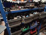 many bins of assorted items on a shelf