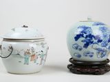 two vases sitting next to each other on a table