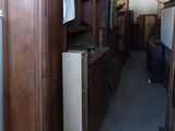 a refrigerator and a refrigerator freezer in a room full of cabinets