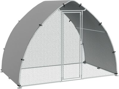 a large metal shelter with a mesh door and a metal frame
