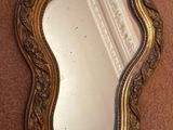 a mirror that is on the wall next to a wall