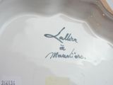 a close up of a plate with writing on it