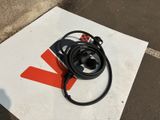 an electric charger that is sitting on the ground