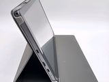 a laptop that is sitting on top of a stand