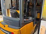 a forklift truck that is parked in a warehouse