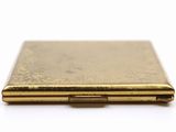a gold case that is sitting on a white surface