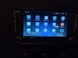 an image of a car dashboard with a display of apps on the screen
