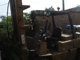 a forklift that is sitting in the back of a truck