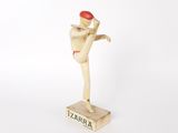 wooden figurine of a baseball player with a red hat on his head