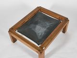 an image of a small wooden table with a chalk board on it