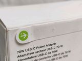 a white box with a green sticker on it