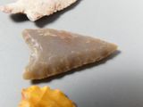 three different types of arrowheads on a table