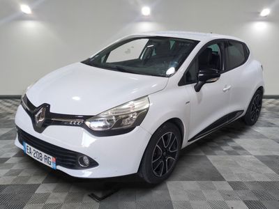the white car is parked on a checkered floor in the garage