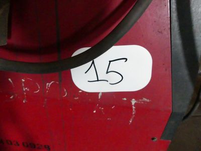 a picture of a red machine with a number on it