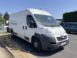 a white van that is parked on the side of the road