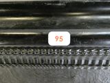 a close up of a black vase with a number on it