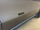 a close up of a car door with a sticker on it