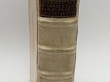 an old book that is sitting on a table