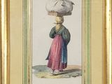an old picture of a woman carrying a basket on her head