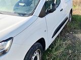 a white van that is parked in the grass