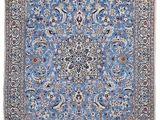 un tapis bleu avec un motif en médaillon