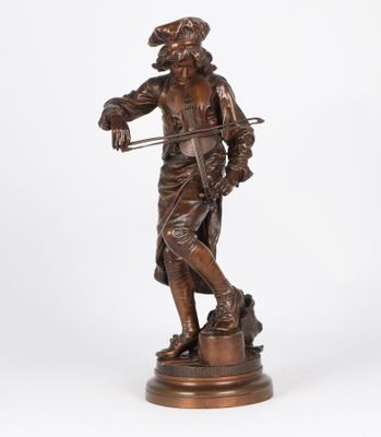 a bronze statue of a man with a cane and hat