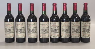 six bottles of wine are lined up on a table