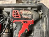 a cordless drill in a tool box with other tools