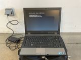 a laptop that is sitting on top of a suitcase