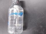 a bottle of water that is sitting on a table