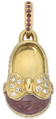 an image of a gold plated pendant with a purple and white purse