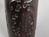 a wooden cup that has a design on the inside of it