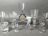a lot of wine glasses that are sitting on a table