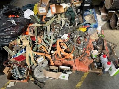 a pile of assorted items sitting on the floor