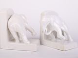 pair of white elephant bookends on a white background