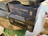 a stack of boxes and a pair of shoes on a table