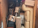 a wooden box filled with assorted items inside of it