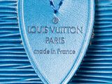a close up of a blue louis vuitton bag