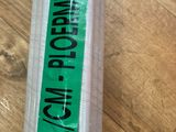 a roll of plastic wrapped up on a wooden table