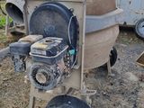 a machine that is sitting on the ground in the dirt
