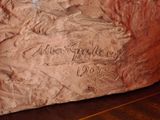a stone with writing on it sitting on a table