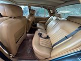 beige leather seats in the back of a car in a parking lot