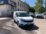 a white van that is parked in front of a building
