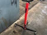 graffiti on the wall of a garage with a bike on a stand