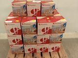 several boxes of food are stacked on a pallet in a room