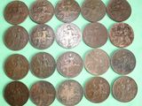 some coins are arranged in a circle on a green surface