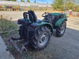 a tractor that is parked on the side of the road