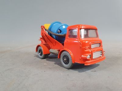 a toy truck with a cement mixer on the back of it