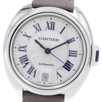 a close up of a wrist watch with roman numerals