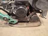 a close up of a lawn mower on the ground